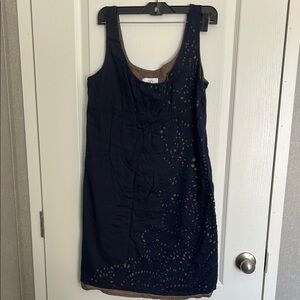 Loft navy blue sleeveless dress featuring embroidery and a tan underlining.